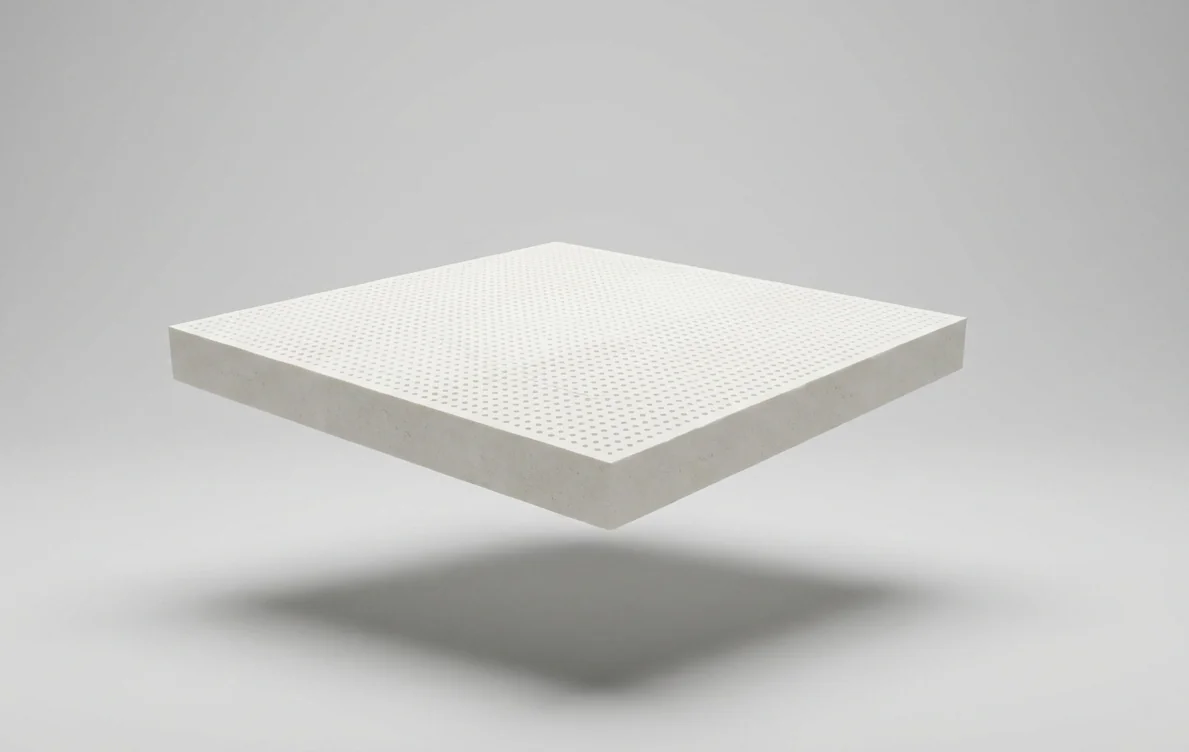 Natural latex block shown from above with a perforated surface