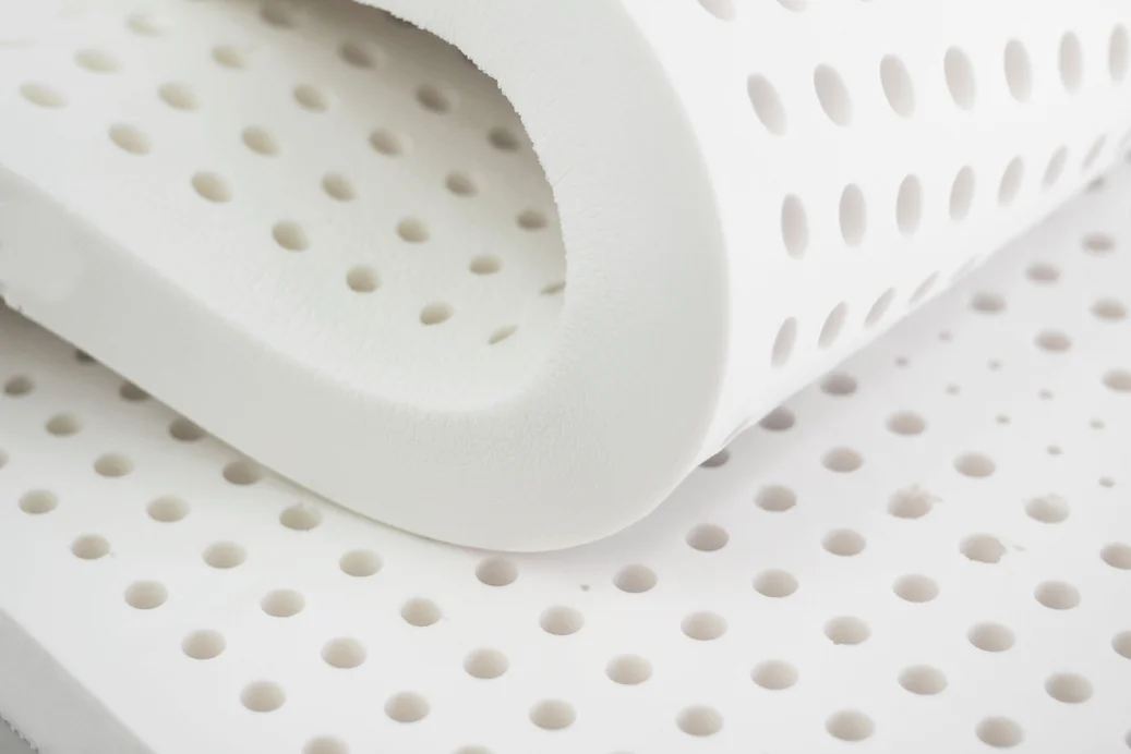Rolled natural latex sheet showing its flexibility
