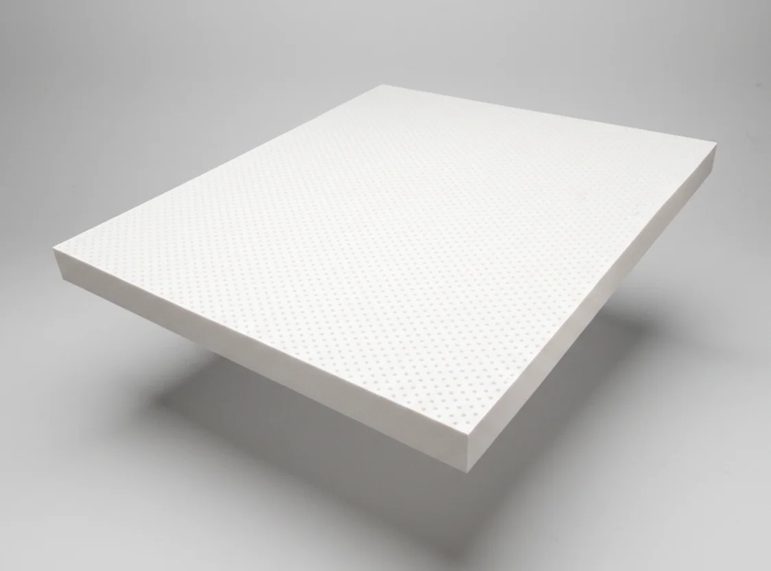 Thick natural latex block with rows of pinholes, shown at an angle